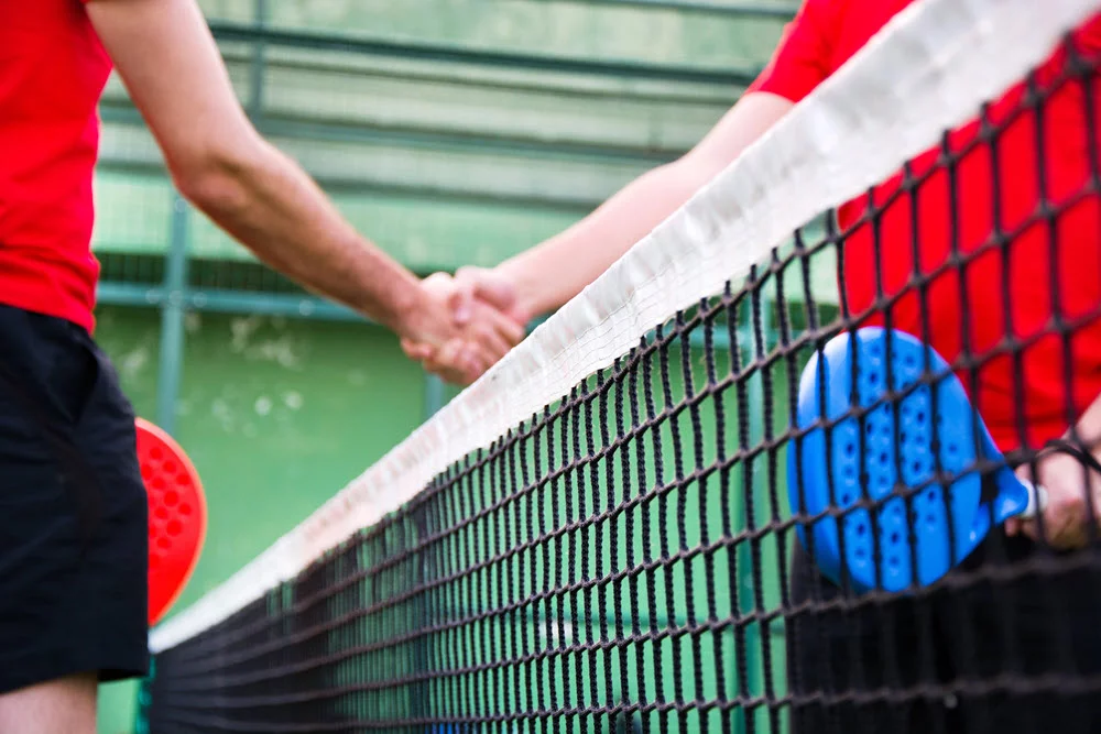 Padelspillere der siger tak for kampen